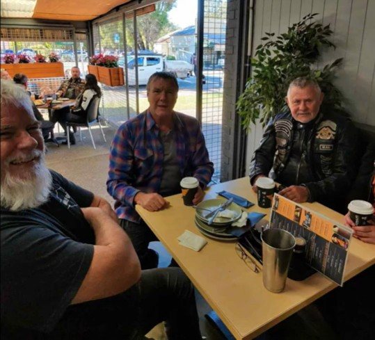 Chapter members seated inside Harry's Place Café