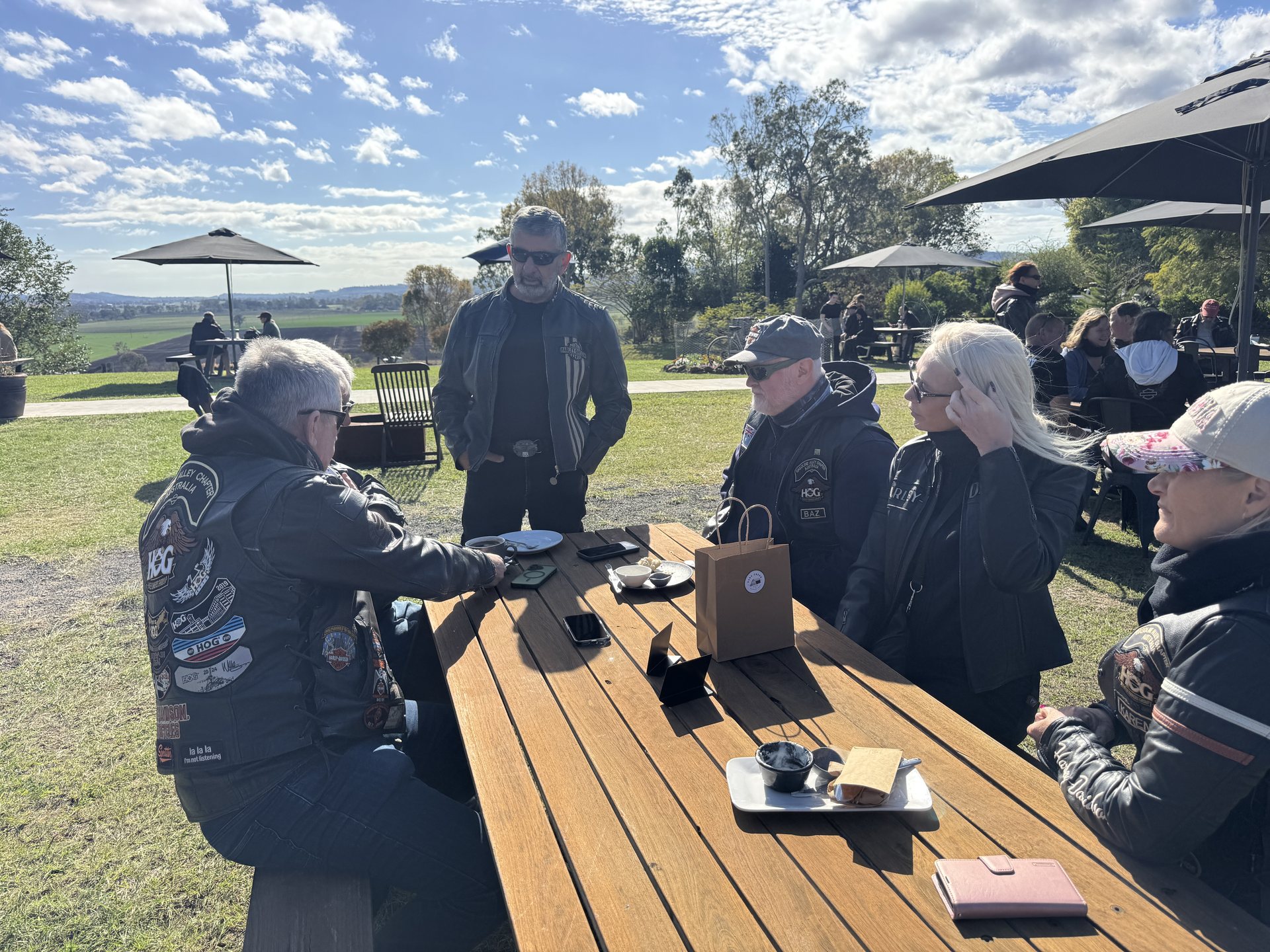 Chapter members at a picnic table during morning tea at Oaky Creek Farm