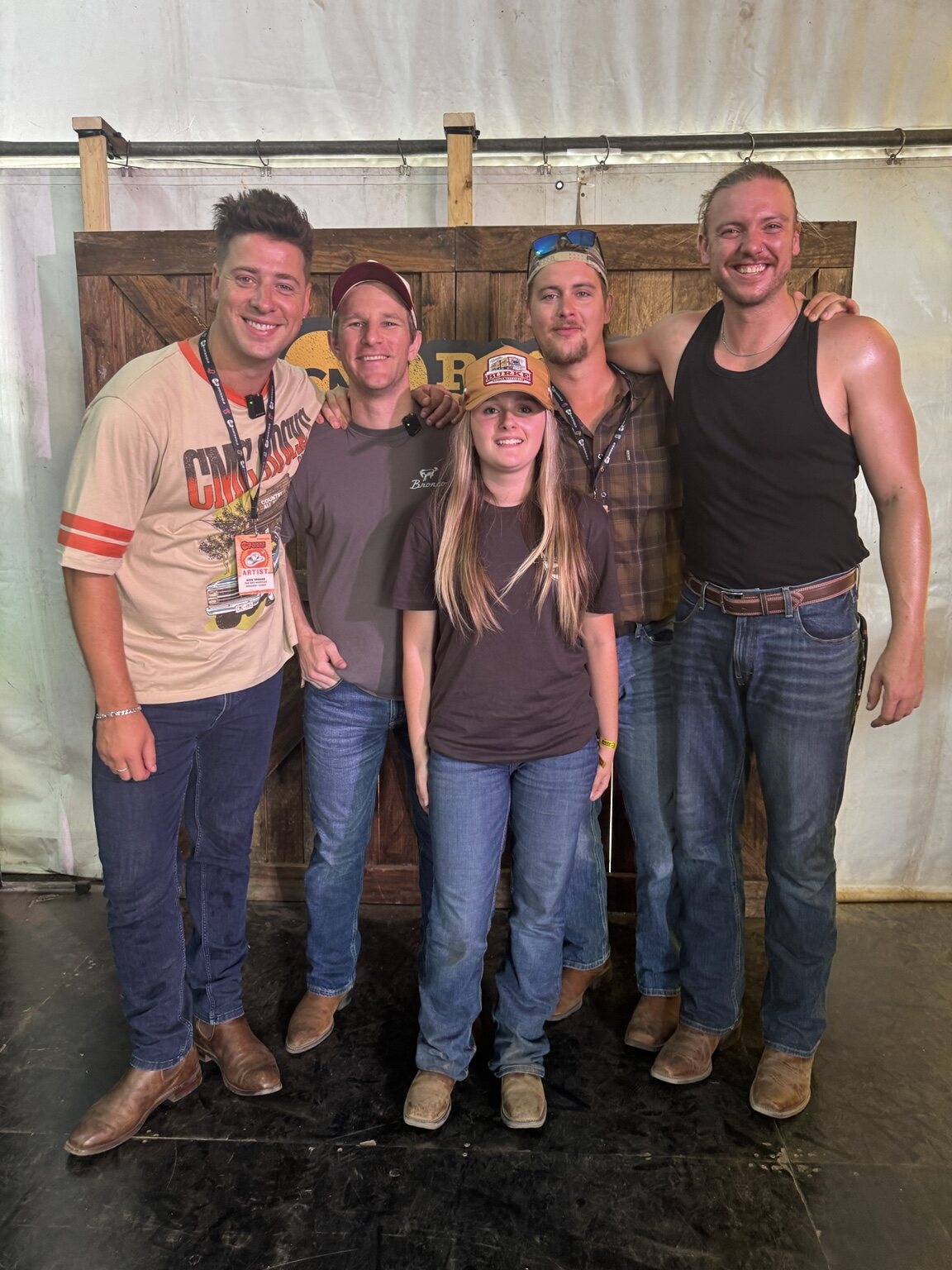 Zoe posing with performers at CMC Rocks