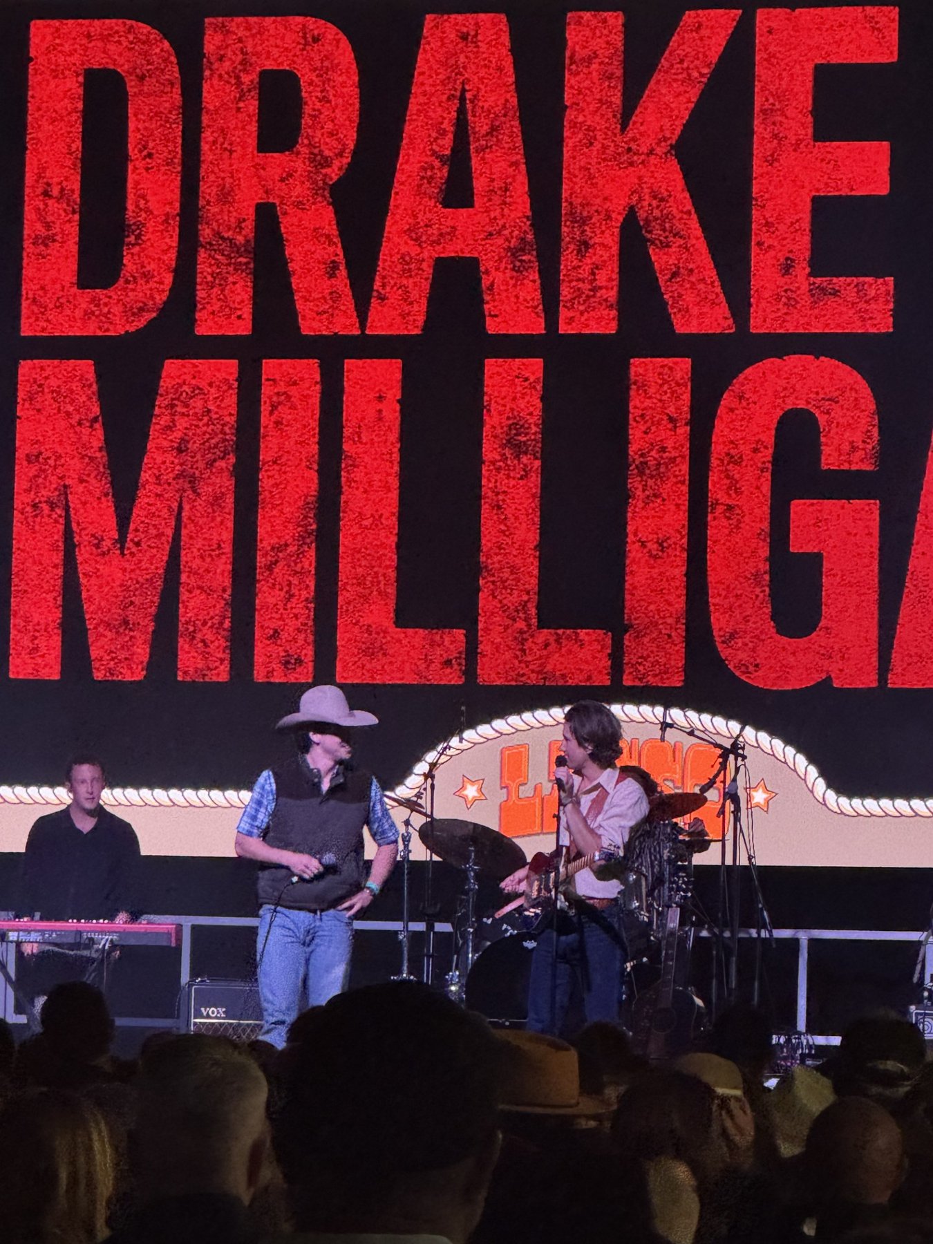 Mack Geiger joining Drake Milligan on stage at Lasso Country Music Festival