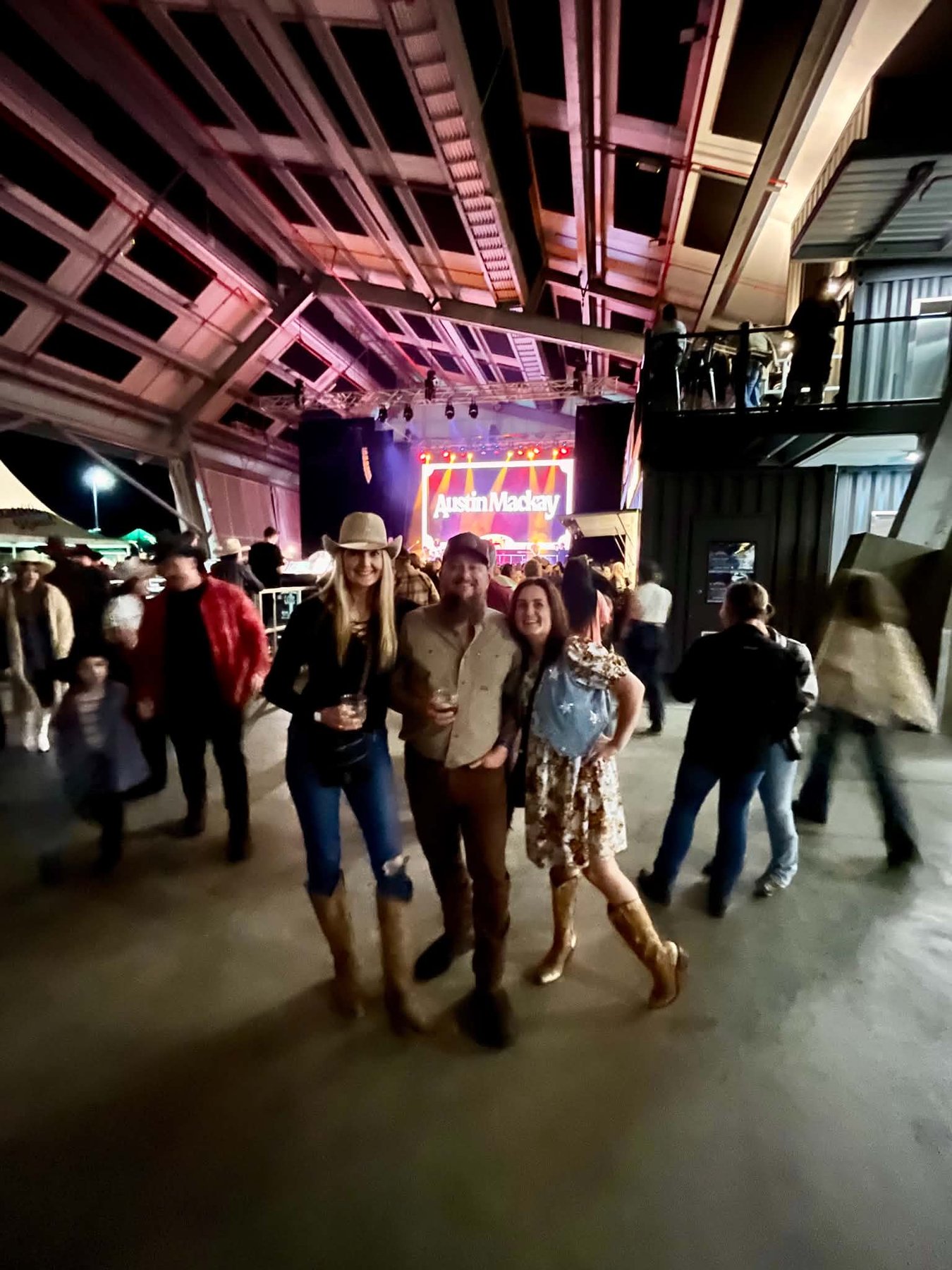 Three friends inside Distillery Road Market during Lasso Country Music Festival