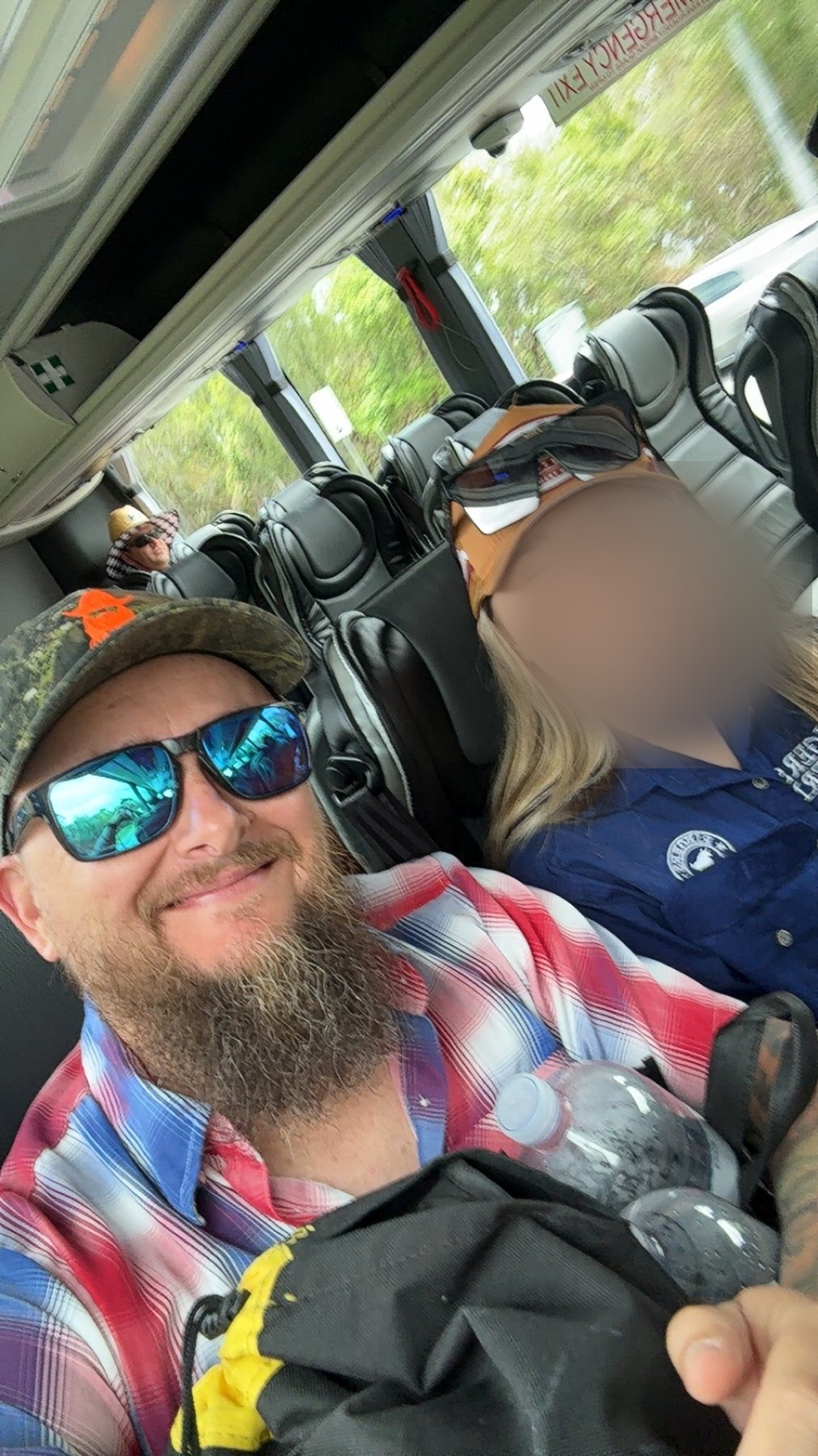 Shane and Zoe travelling aboard the festival shuttle bus