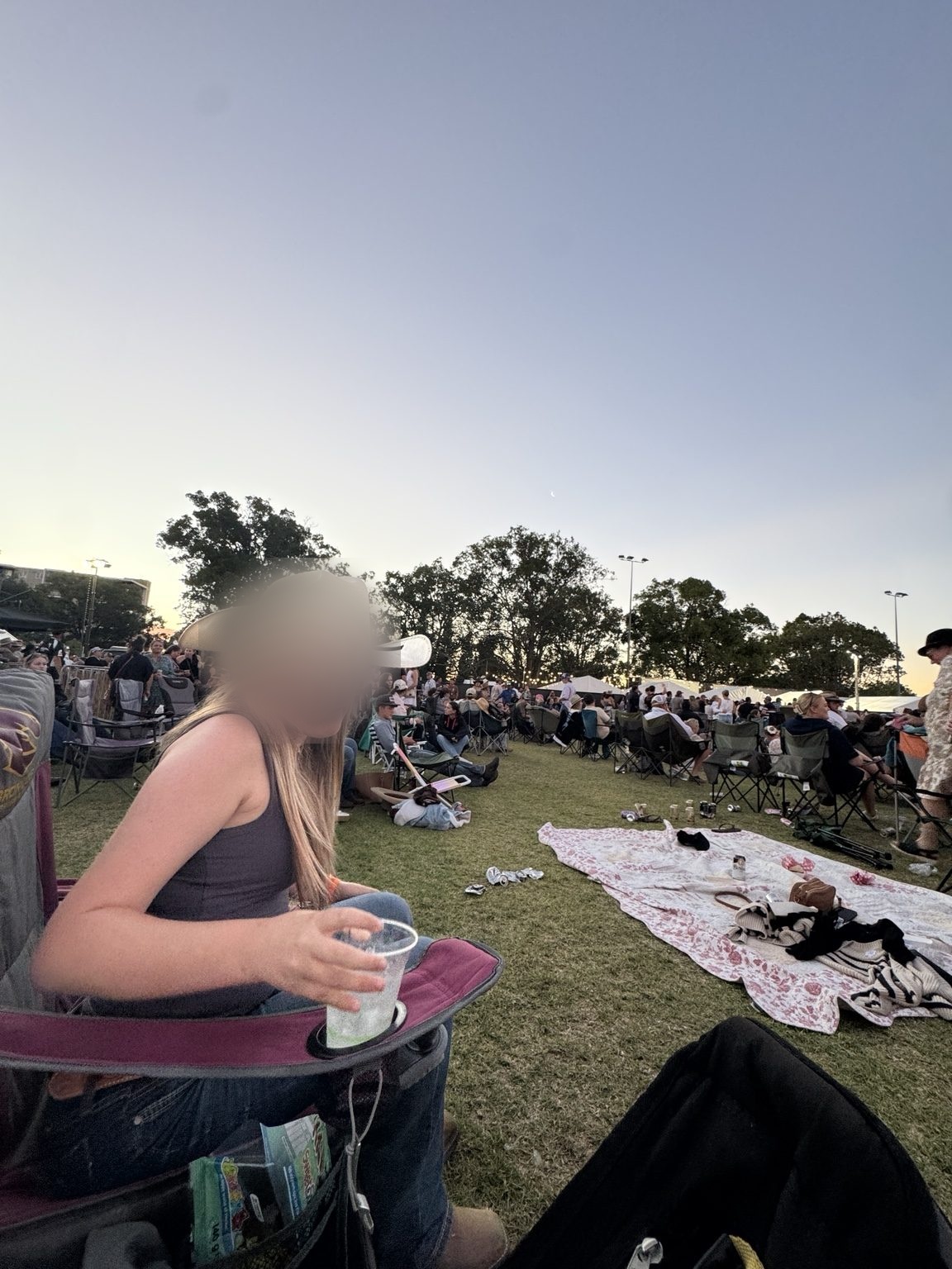 Zoe sitting in her chair during the evening crowd at Sunburnt Country