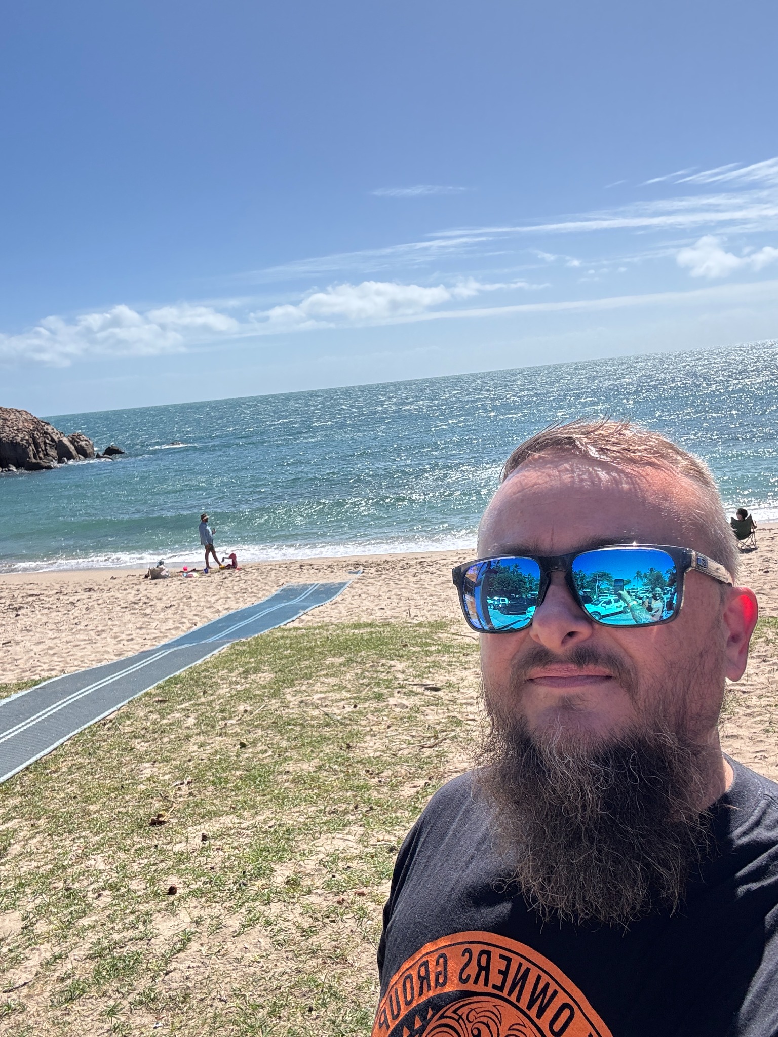 Selfie beside a sunny beach during the sightseeing ride.