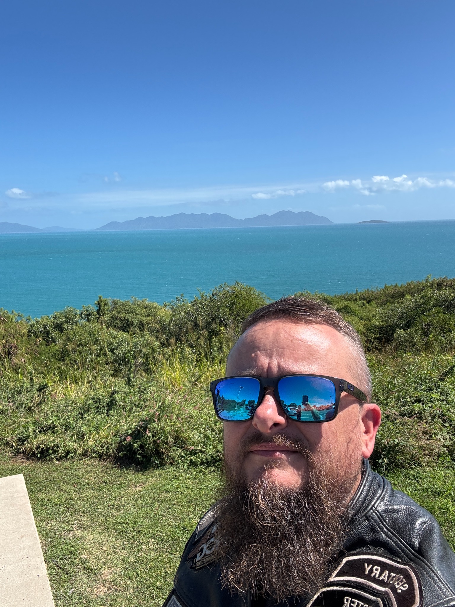 Selfie at a coastal lookout with the Whitsunday islands in the background.