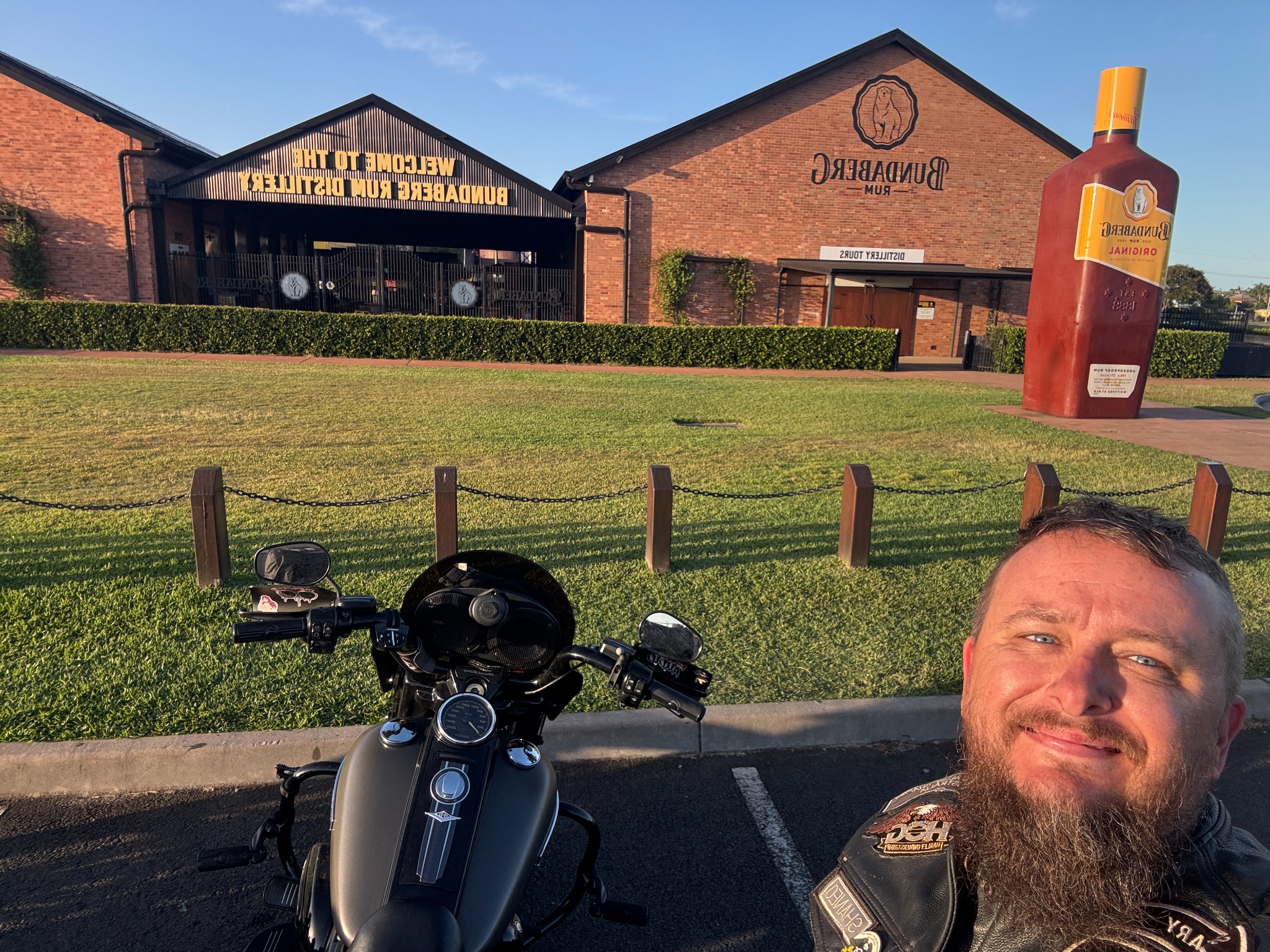 Selfie with a Harley-Davidson motorcycle outside the Bundaberg Rum Distillery.