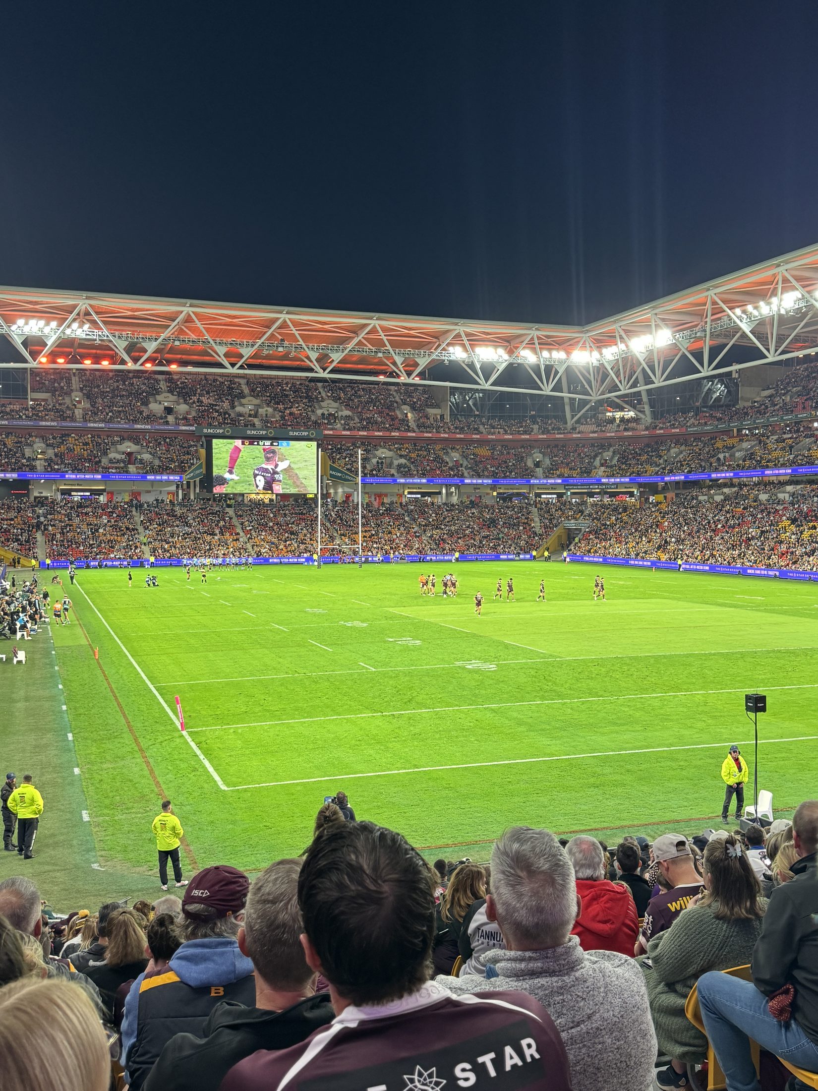 Night football match in Brisbane after returning from K'gari.