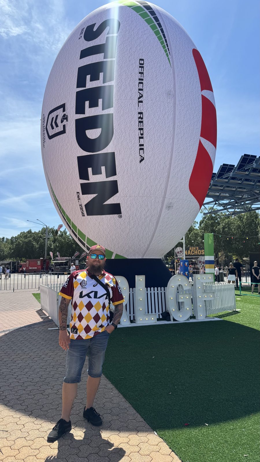 Shane at the giant Steeden football display outside Accor Stadium