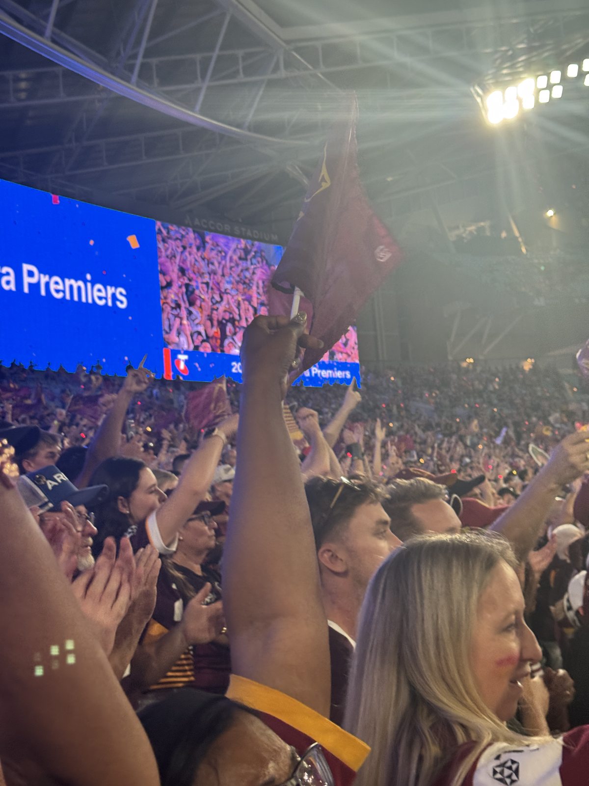 Brisbane Broncos supporters celebrating inside Accor Stadium