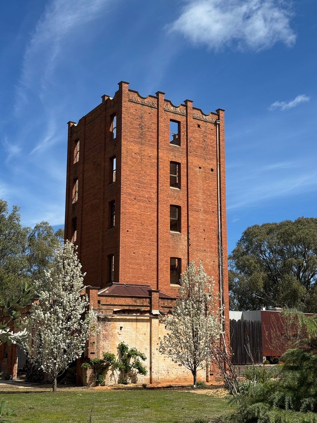 A tall historic brick water tower in Narrandera.