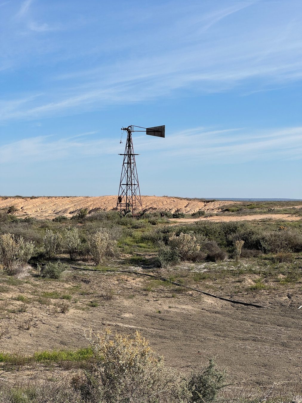 A windmill standing against the open Mungo landscape.